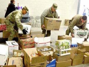 Volunteers preparing for 37th Holiday Food and Toy Distribution